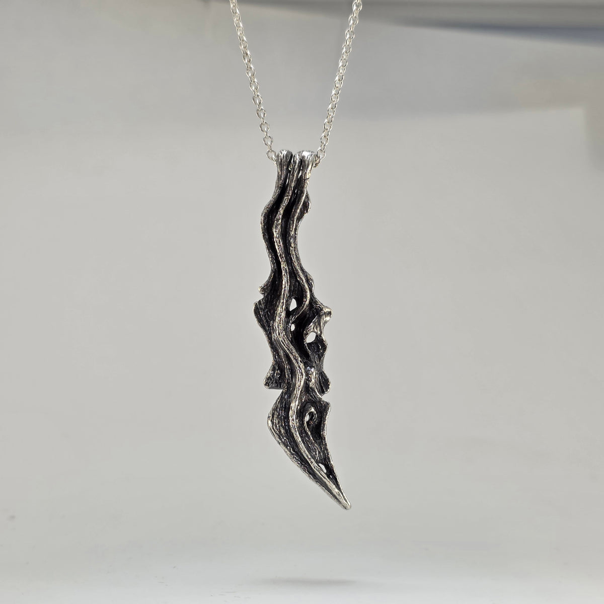 driftwood branch sterling silver pendant with oxidized finish to show wooden texture