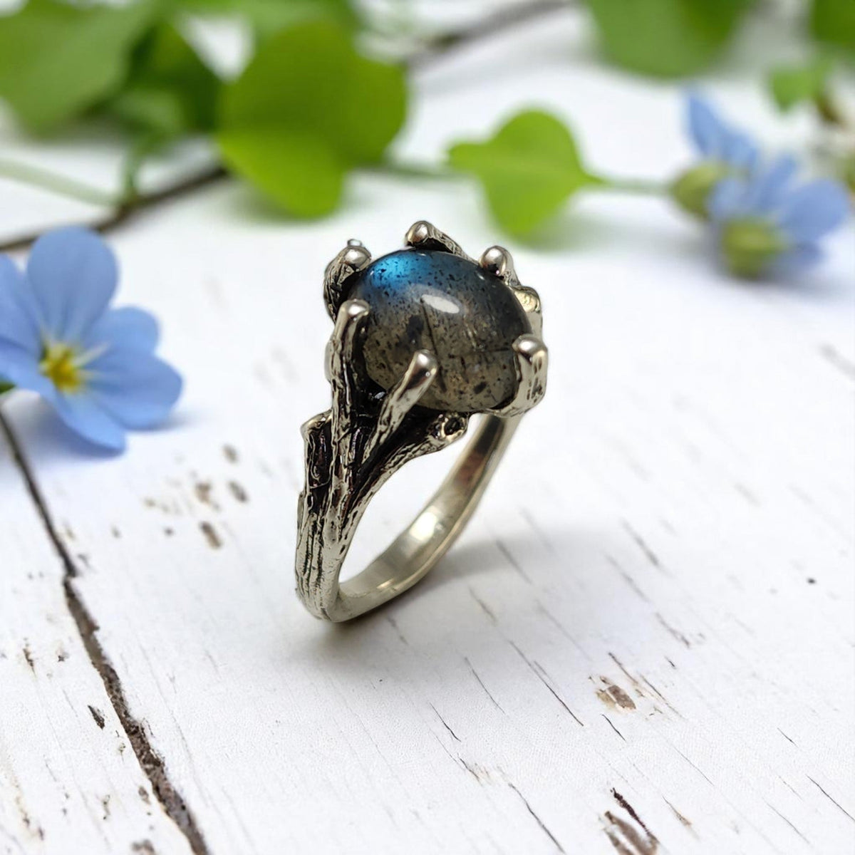 Labradorite sterling silver twig ring, nature-inspired solitaire with blue-green gemstone.