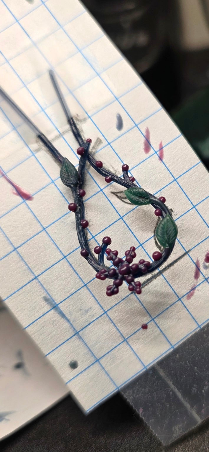 Lost wax wax model of a nature-inspired ring holder pendant featuring entwined branches, leaves, and a snowflake motif