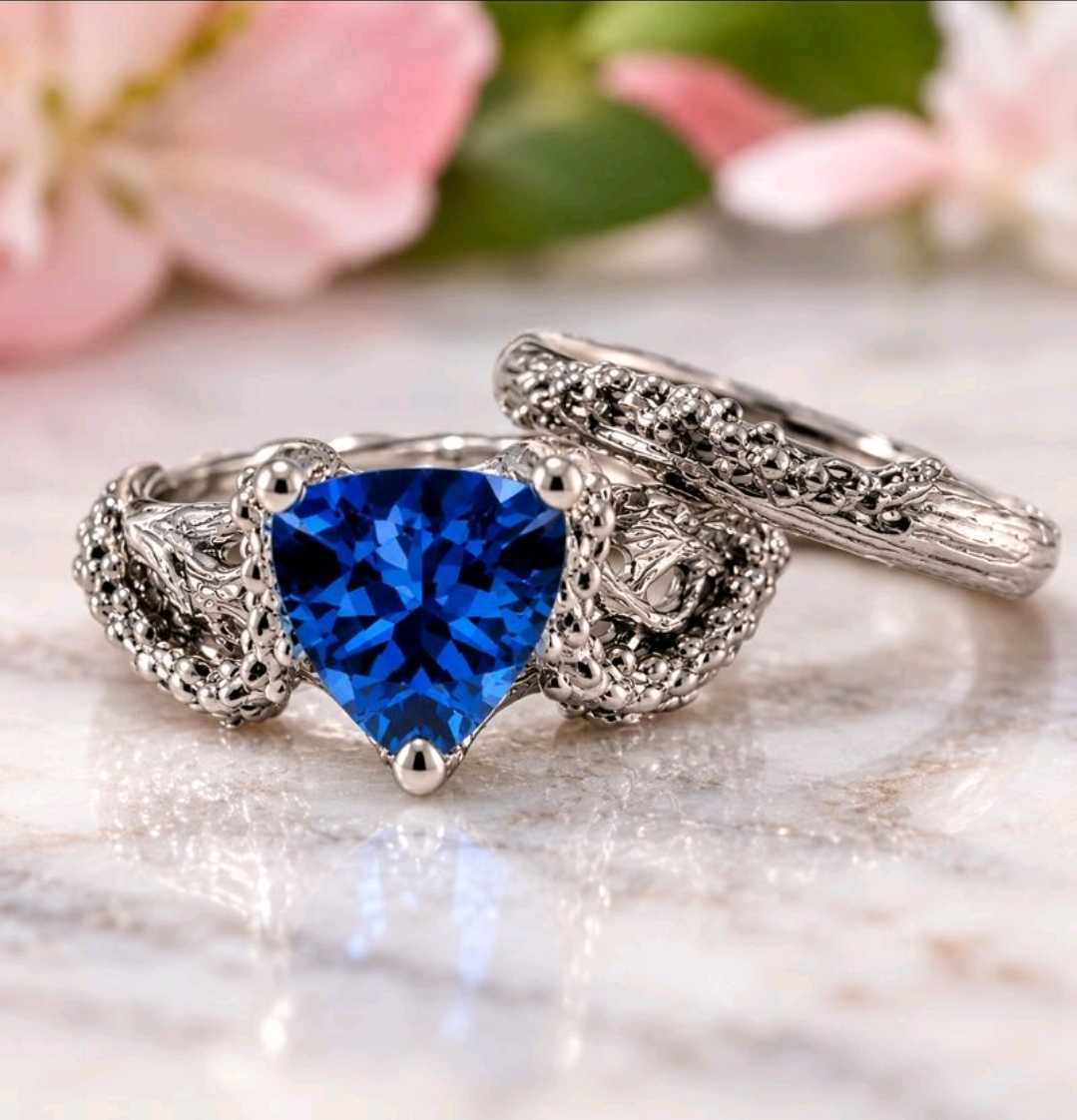 blue trillion cut sapphire ring with starfish design