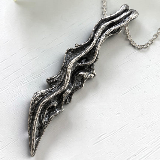 driftwood branch sterling silver pendant with oxidized finish to show wooden texture