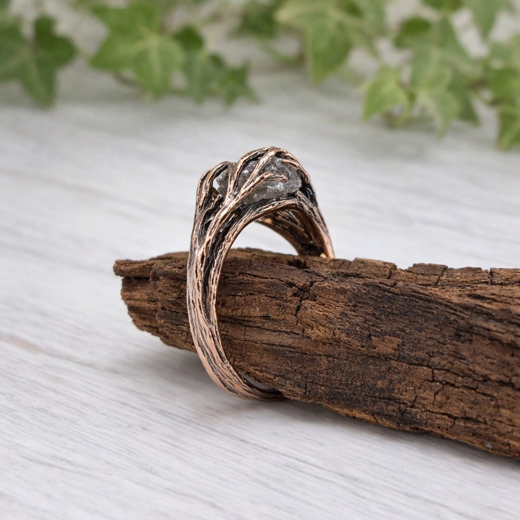 raw rough diamond in a handmade twig and branch style solid gold setting