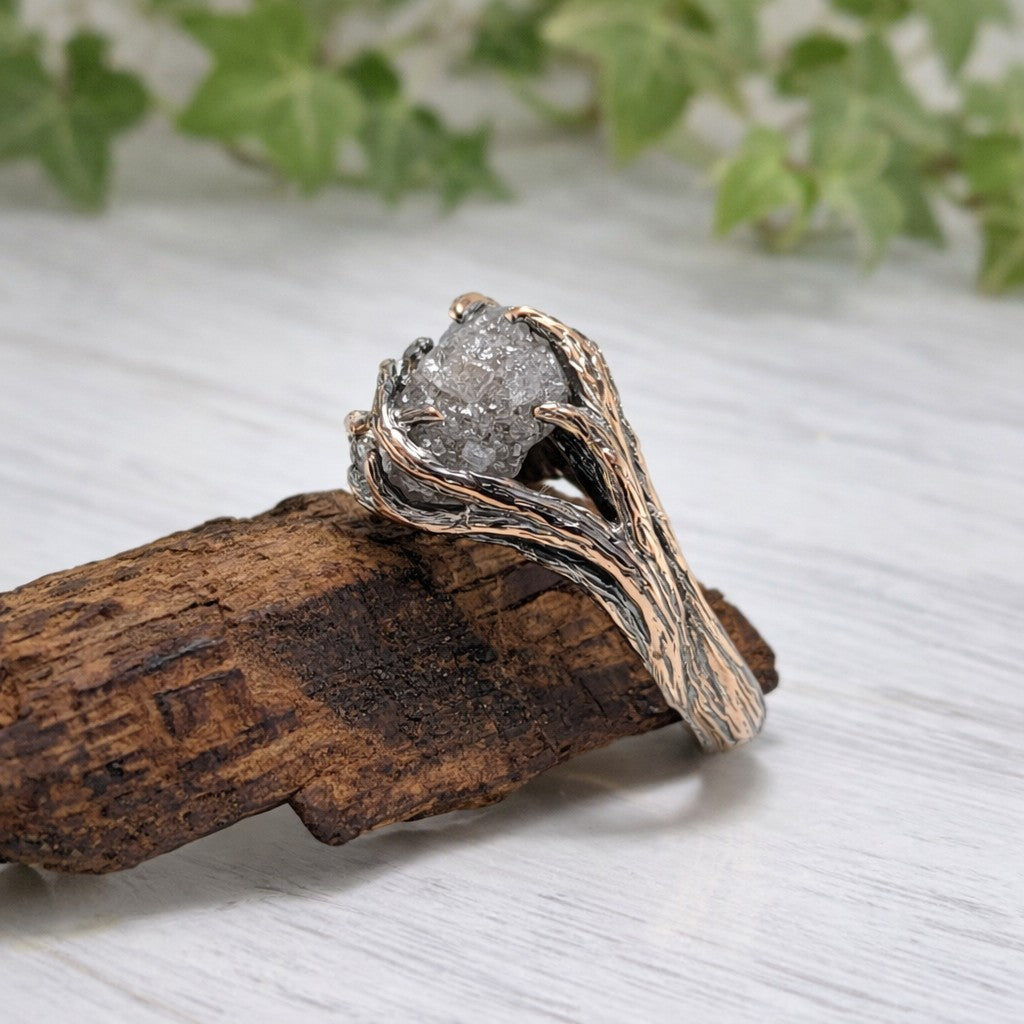 raw rough diamond in a handmade twig and branch style solid gold setting
