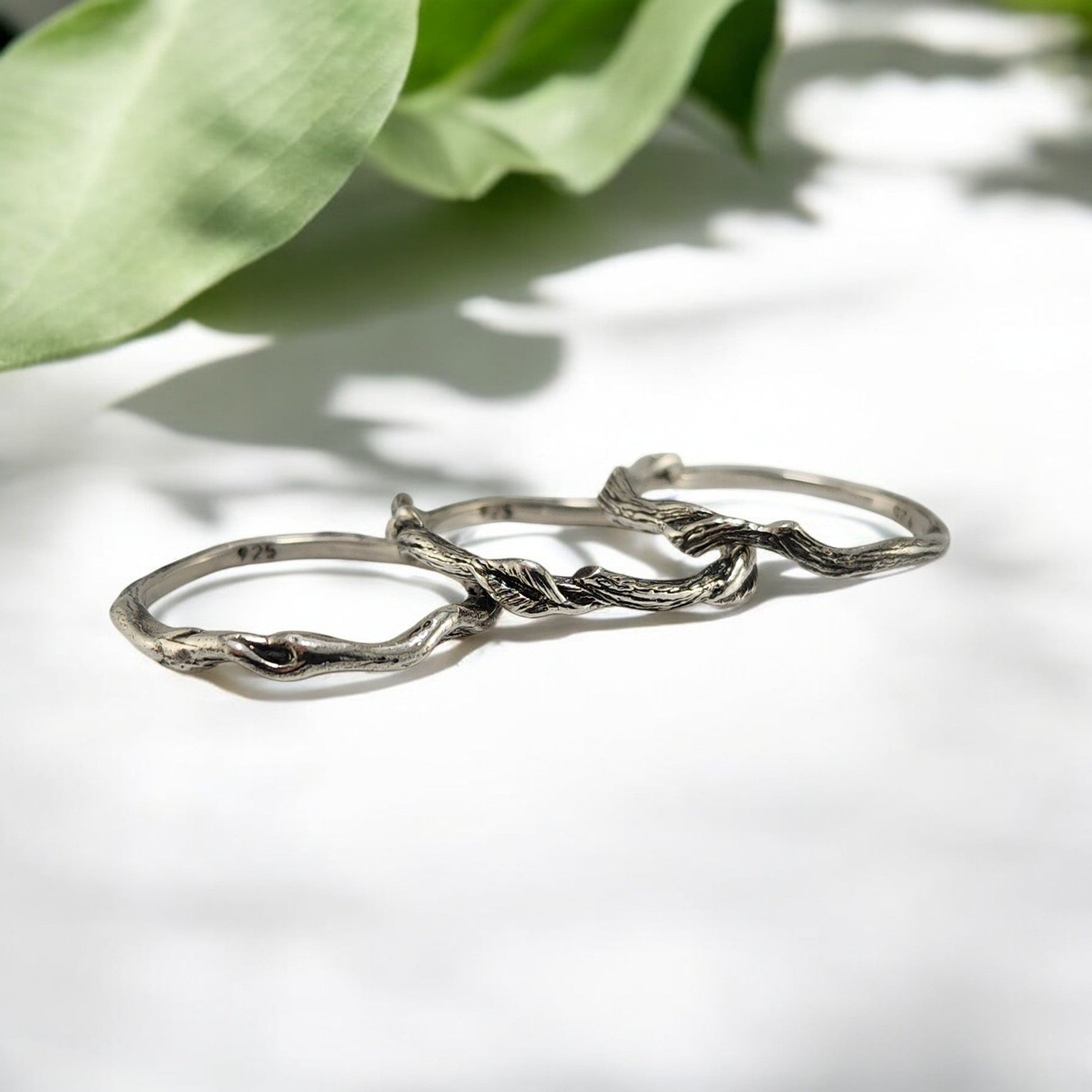 3 silver rings with vines and leaves locking together in a set of 3