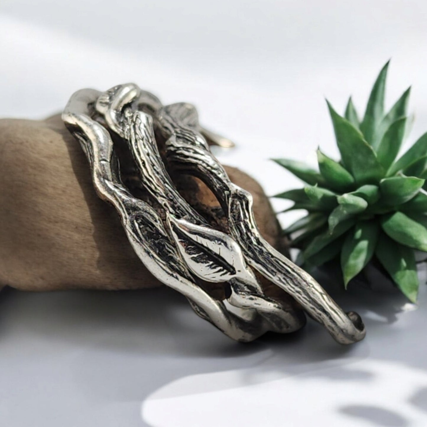 3 silver rings with vines and leaves locking together in a set of 3