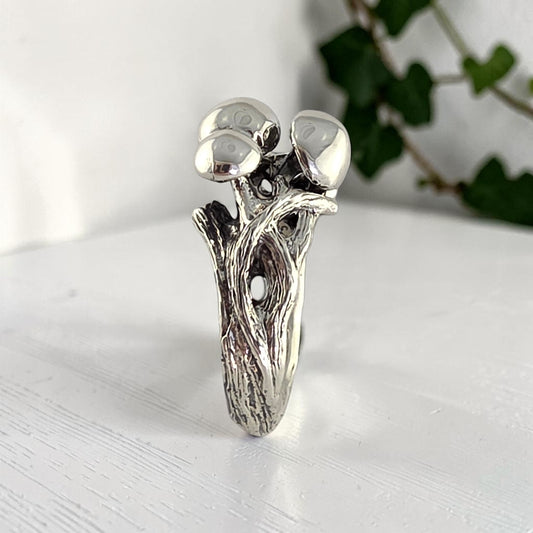 sterling silver ring with three mushrooms coming out of the top
